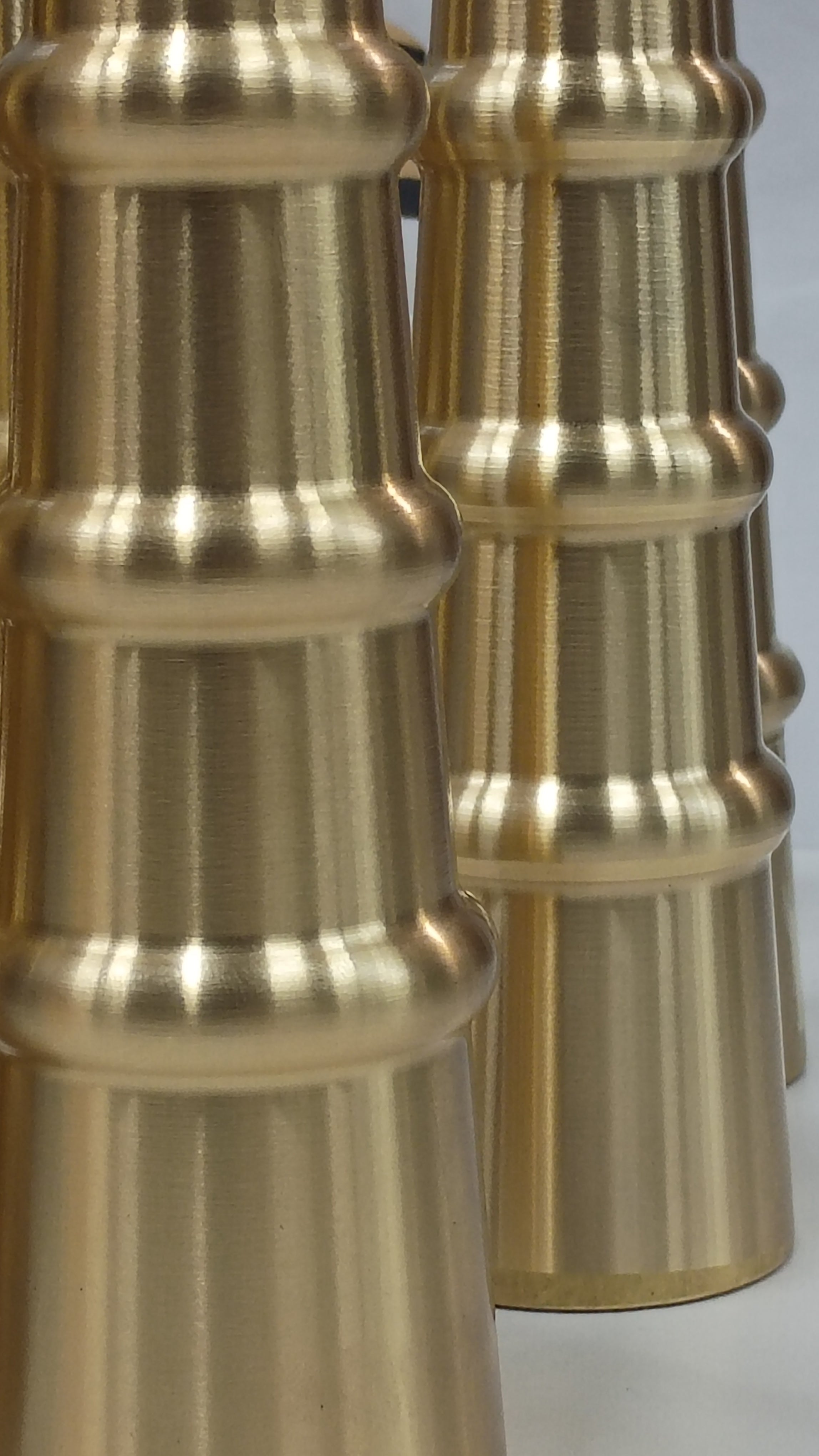 Close-up of ribbed brass fitting texture, CNC Metal Works
